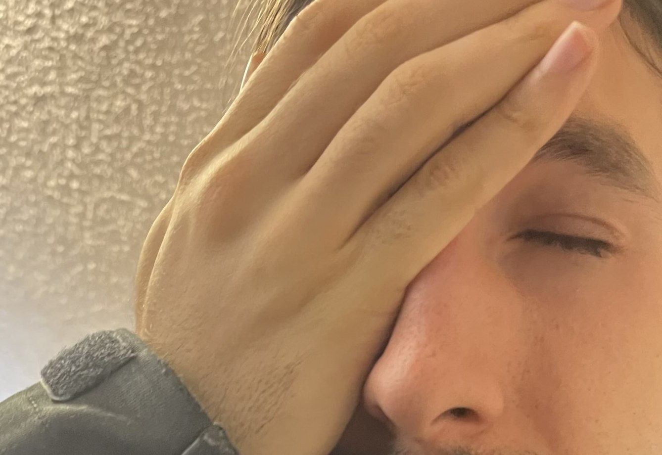 Person with Palm of the Hand over the Face