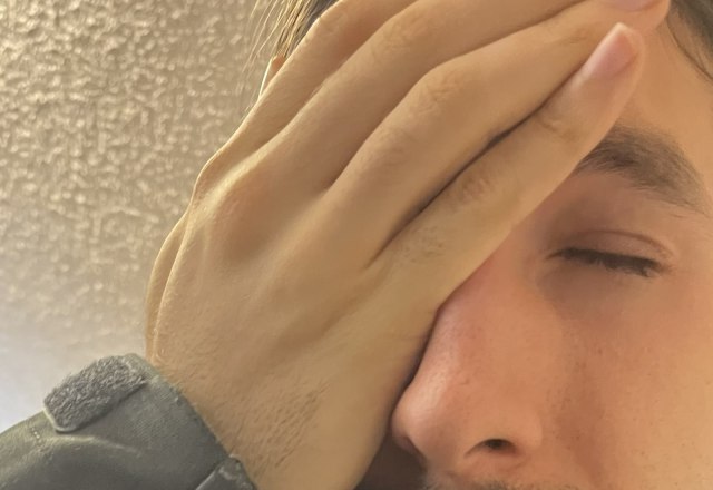 Person with Palm of the Hand over the Face